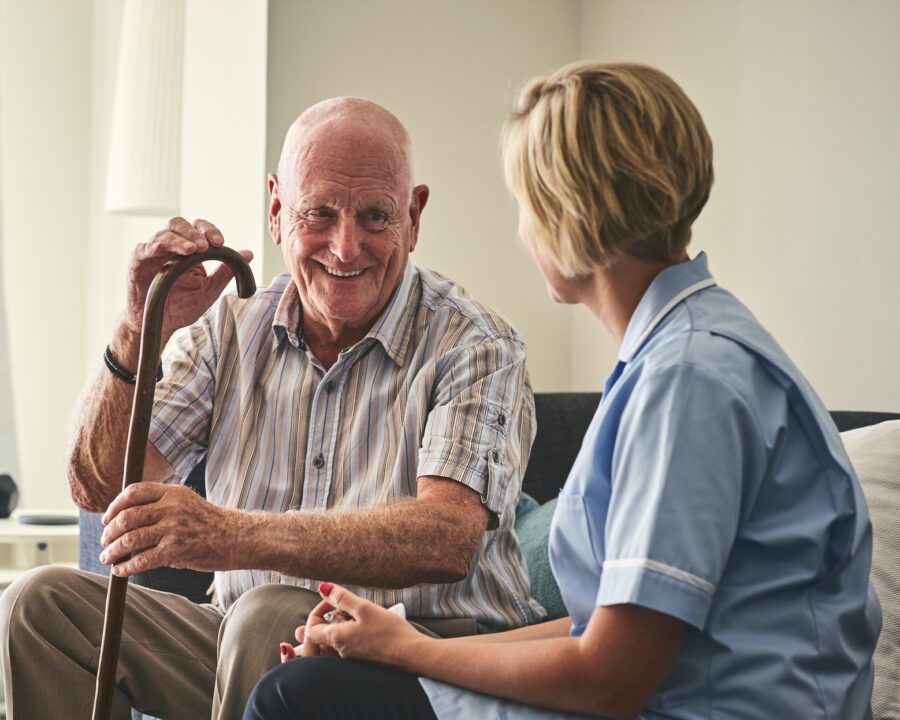 Care home resident with care worker