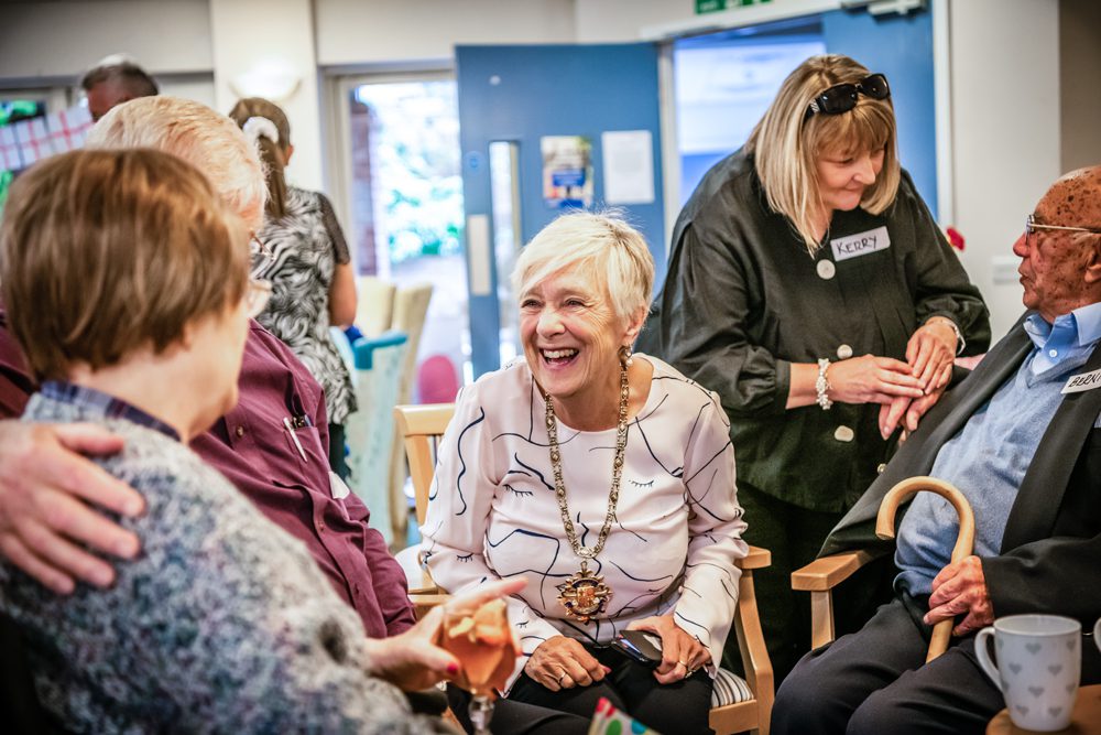 The Mayor of Woking speaking with volunteers at the event