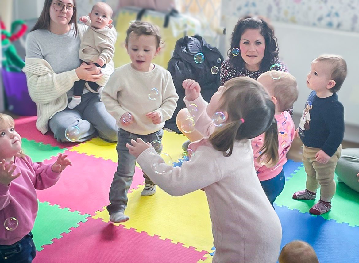 Children during Musical Bumps playing with bubbles