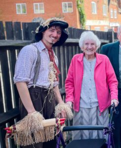 A resident stood with a performer dressed as the scarecrow. 