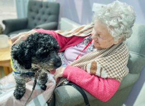 Resident and dog cuddles.