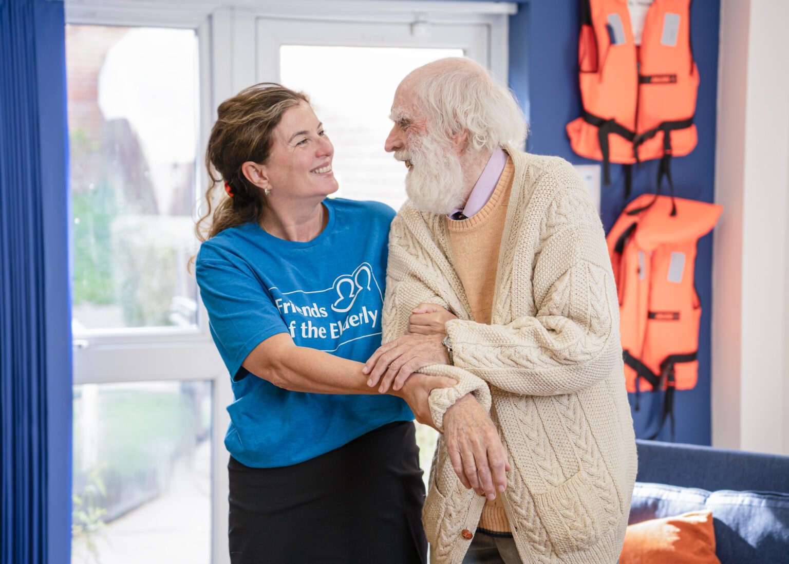 Fote Image of carer staff talking with a resident