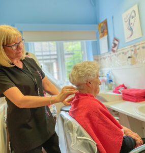 A Redcot resident during their hairdressing appointment.