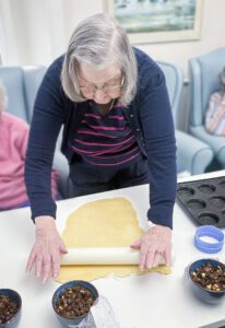 Susan rolling out the dough. 