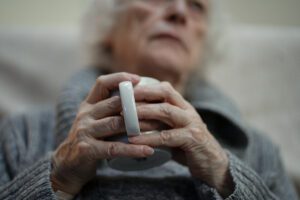 Stock image of a woman holding a mug.