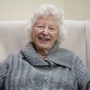 2024 December highlights: A stock image of an older woman smiling. 