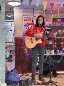 A performer playing guitar.