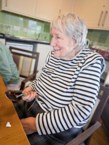 A resident holding a trowel. 