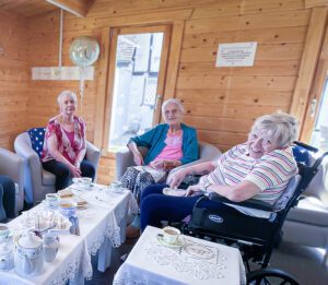 Marion with her care home friends on her birthday.