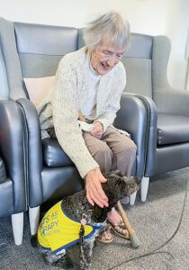 Jill now, cuddling Winnie the dog.