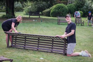 Access Volunteers Cara and Max working on a bench