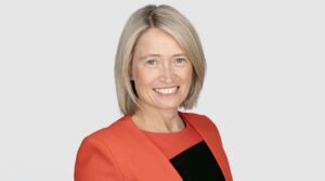 Headshot of CEO Rachel Hill smiling into the camera